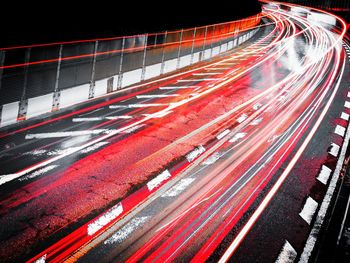 Light trails on highway in city at night