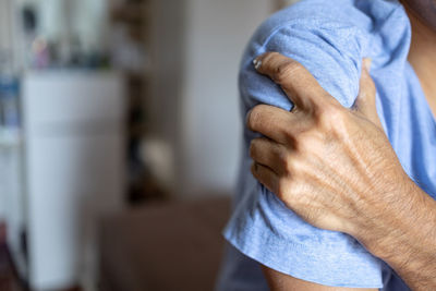 Close-up of man holding hands