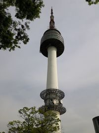 Low angle view of communications tower against sky