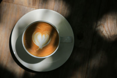 High angle view of coffee cup on table