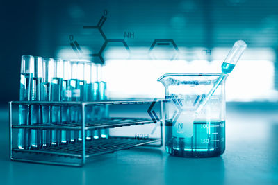 Digital composite image of laboratory equipment and scientific formulas