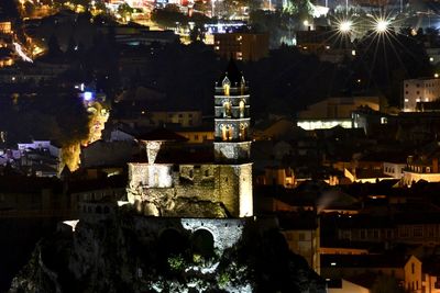 High angle view of illuminated buildings in town at night