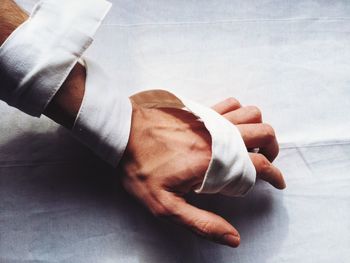 Close-up of hand wrapped with bandage
