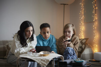 Children playing video games at home