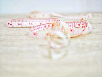 Close-up of tape measure on table