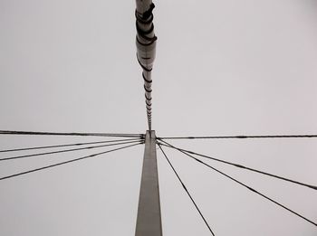 Low angle view of cables against clear sky