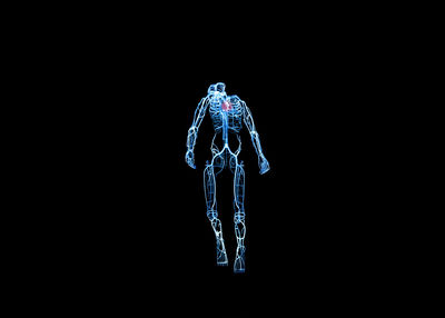 Digital composite image of skeleton on black background