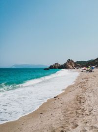 Scenic view of beach against clear sky