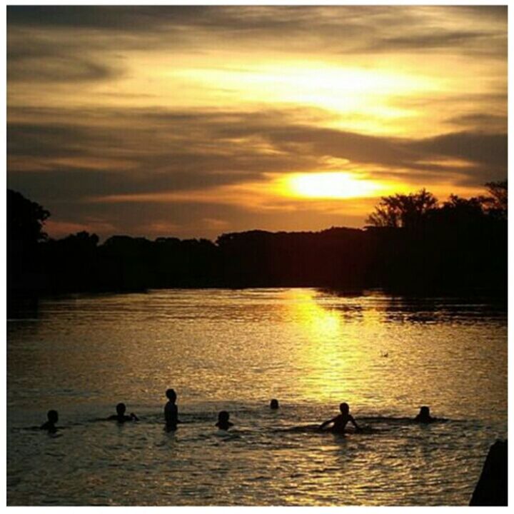 sunset, transfer print, water, bird, animal themes, silhouette, wildlife, sky, reflection, animals in the wild, lake, auto post production filter, scenics, duck, beauty in nature, waterfront, tranquil scene, orange color, swimming, nature