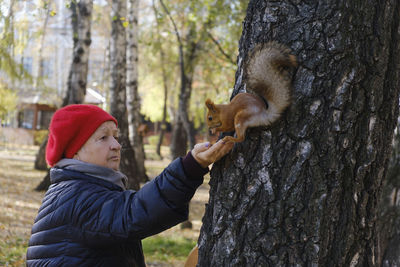 Man holding squirrel