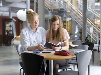 University students studying in cafe