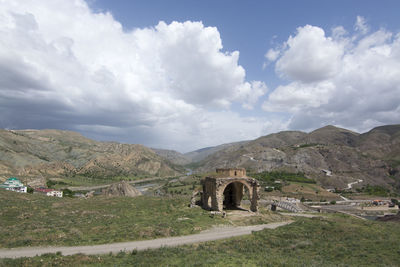 Old ruins on mountain against sky