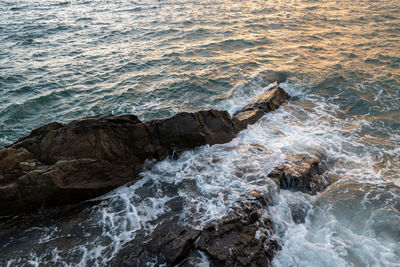 High angle view of rocks in sea