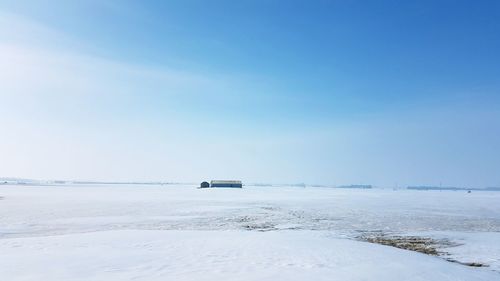 Scenic view of frozen sea against sky during winter