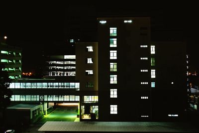 Illuminated modern building in city at night