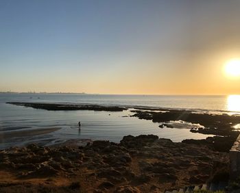 Scenic view of sea against sky during sunset