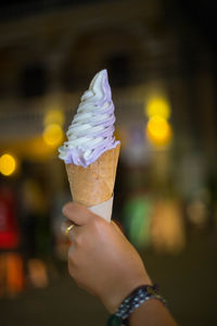 Cropped hand of woman holding ice cream cone