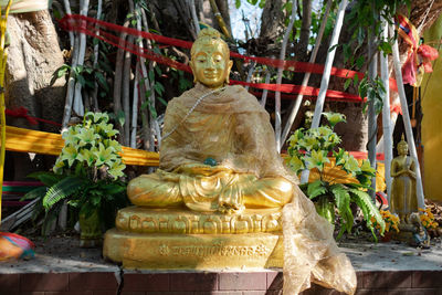 Statue against temple outside building