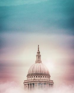 High section of cathedral against dramatic sky during sunset