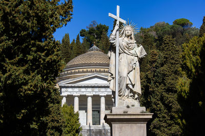 Low angle view of statue against building