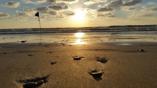 Scenic view of sea against sky at sunset