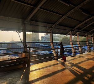 Shadow of man on bridge