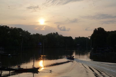 Scenic view of lake against sky during sunset