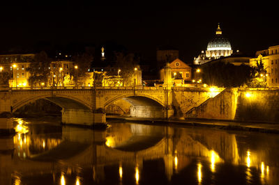 Bridge over river at night