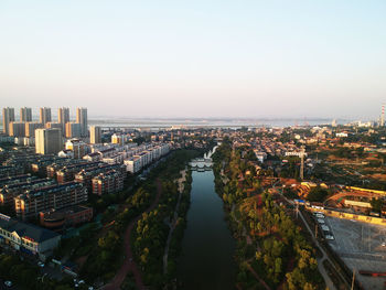 High angle view of buildings in city against clear sky