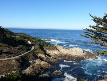 Scenic view of sea against clear blue sky