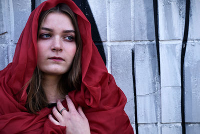 Portrait of a beautiful young woman in red