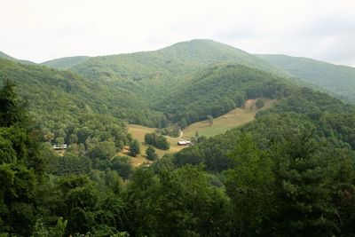 High angle view of trees and mountains against sky