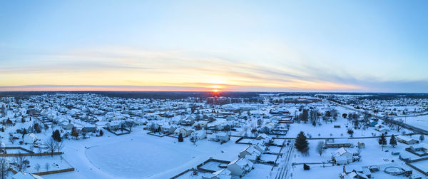 High angle view of city at sunset