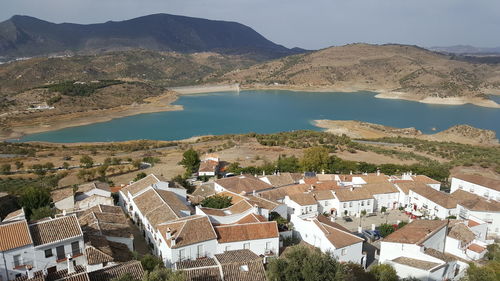 High angle view of townscape by mountains