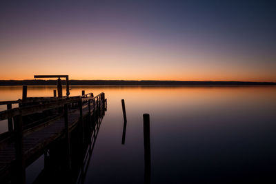 Scenic view of sea against clear sky during sunset