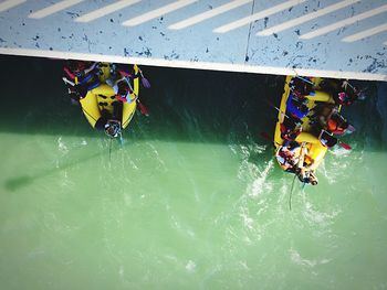 High angle view of people rafting in river