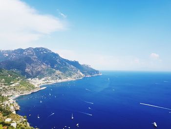 High angle view of sea against blue sky