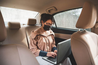 Woman sitting in car