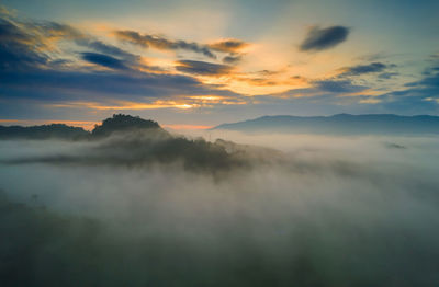 Aerial view beautiful of morning scenery sea of cloud and the fog flows on high mountains.