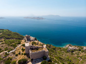 Picture of ancient fortress, sea, blue sky, mountain fortress