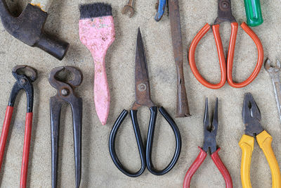 High angle view of various work tools on table