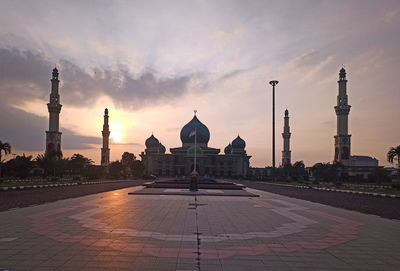 View of buildings against sky at sunset