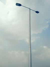 Low angle view of street light against sky