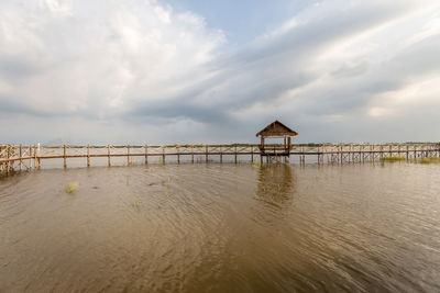 Pier over sea against sky