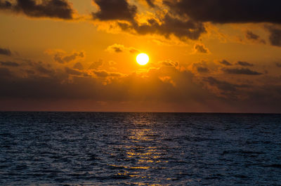 View of calm sea at sunset