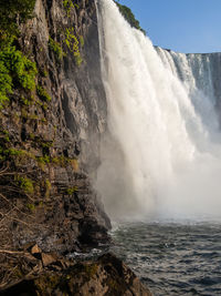 View of waterfall against sky