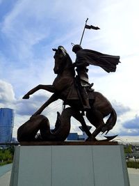 Low angle view of statue against sky