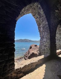 Scenic view of sea seen through rocks