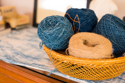 Close-up of thread balls in container