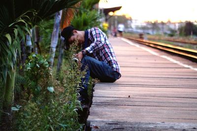 Side view of man on railroad track